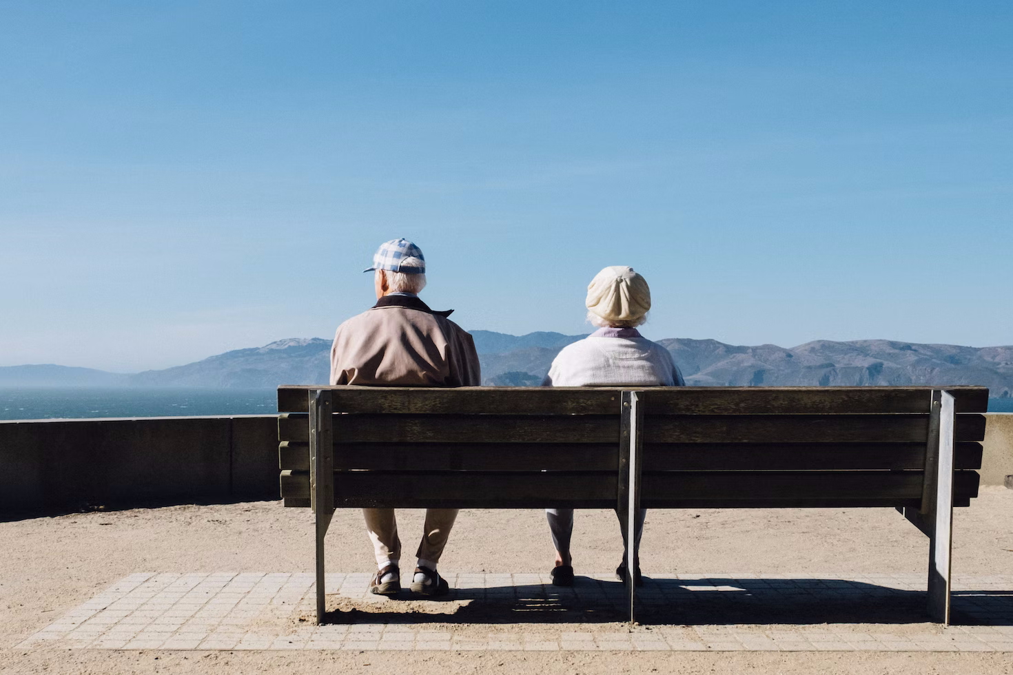Picture of older couple on bench looking at view